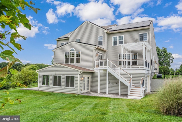 7425 Signal Hill Rd, Manassas, VA 20111 - back of property featuring a pergola, a deck, roof mounted solar panels, stairway, and a patio area