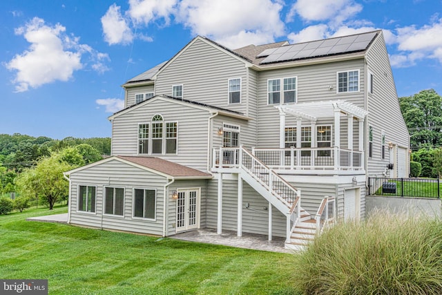 7425 Signal Hill Rd, Manassas, VA 20111 - rear view of property featuring solar panels, a wooden deck, a yard, and a pergola