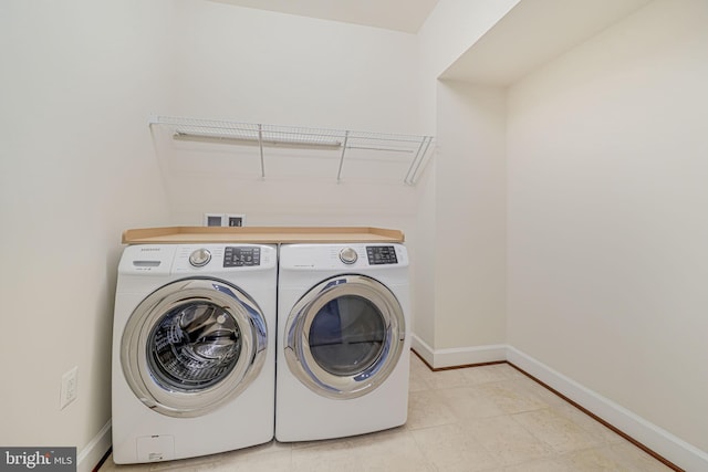 7425 Signal Hill Rd, Manassas, VA 20111 - washroom with washer and dryer and baseboards