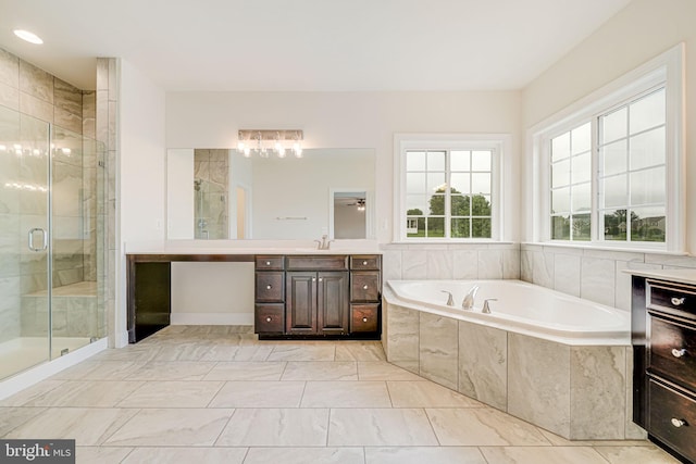 7425 Signal Hill Rd, Manassas, VA 20111 - full bath with vanity, a garden tub, a stall shower, and marble look tile flooring