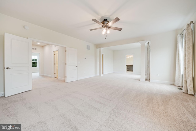 7425 Signal Hill Rd, Manassas, VA 20111 - spare room with ceiling fan, light carpet, and decorative columns