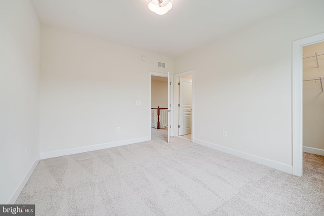 7425 Signal Hill Rd, Manassas, VA 20111 - unfurnished bedroom featuring a spacious closet, carpet flooring, and a closet