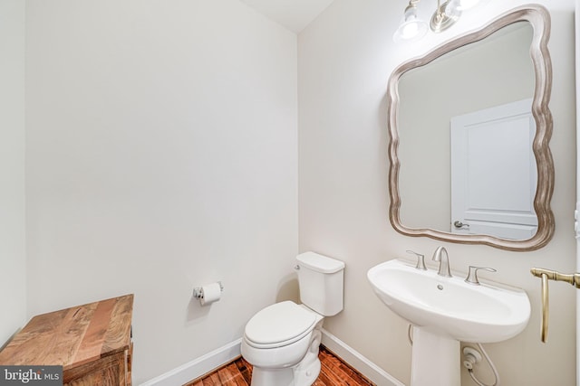 7425 Signal Hill Rd, Manassas, VA 20111 - bathroom with wood finished floors and toilet