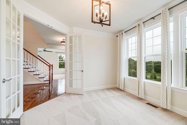 7425 Signal Hill Rd, Manassas, VA 20111 - spare room featuring french doors, healthy amount of natural light, carpet, and ornamental molding