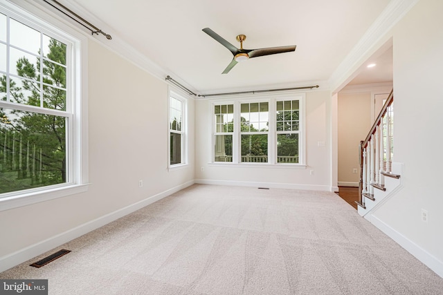 7425 Signal Hill Rd, Manassas, VA 20111 - carpeted empty room with a ceiling fan, ornamental molding, healthy amount of natural light, and stairway
