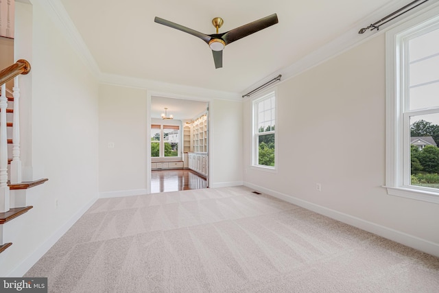 7425 Signal Hill Rd, Manassas, VA 20111 - carpeted spare room with crown molding, plenty of natural light, a ceiling fan, stairway, and a chandelier