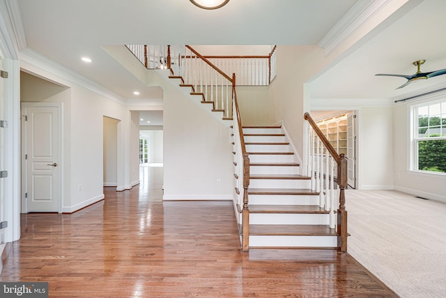 7425 Signal Hill Rd, Manassas, VA 20111 - stairway featuring wood finished floors, crown molding, a ceiling fan, and recessed lighting