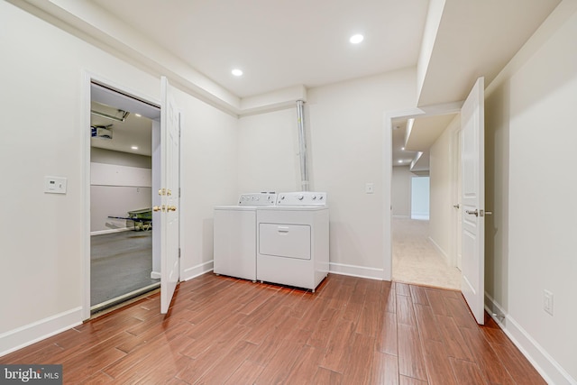 7425 Signal Hill Rd, Manassas, VA 20111 - laundry room with washer and clothes dryer, wood finished floors, and recessed lighting