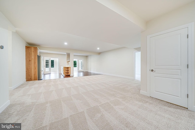 7425 Signal Hill Rd, Manassas, VA 20111 - below grade area featuring light colored carpet, recessed lighting, and freestanding refrigerator