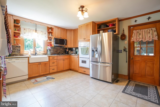 5509 Waterview Dr, Cambridge, MD 21613 - kitchen featuring open shelves, appliances with stainless steel finishes, a sink, and backsplash
