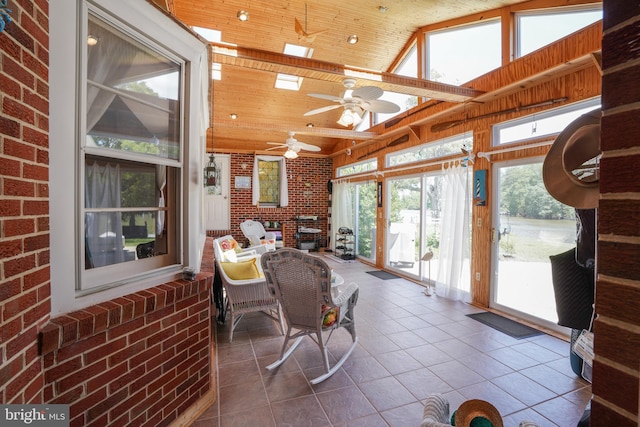 5509 Waterview Dr, Cambridge, MD 21613 - sunroom / solarium with tile patterned flooring, wood ceiling, brick wall, a ceiling fan, and vaulted ceiling