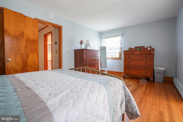 5509 Waterview Dr, Cambridge, MD 21613 - bedroom with light wood-style flooring, baseboards, and baseboard heating