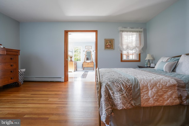 5509 Waterview Dr, Cambridge, MD 21613 - bedroom with baseboard heating and wood finished floors