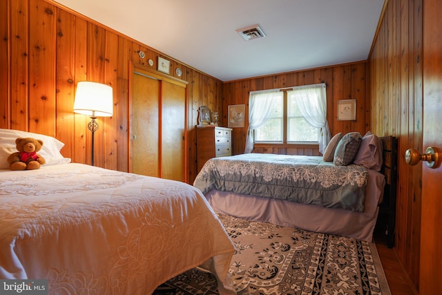 5509 Waterview Dr, Cambridge, MD 21613 - bedroom featuring wooden walls and a closet