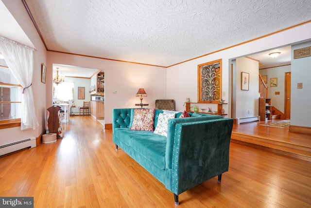 5509 Waterview Dr, Cambridge, MD 21613 - living area featuring ornamental molding, baseboard heating, wood finished floors, a chandelier, and a textured ceiling