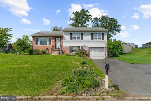 521 Swamp Creek Rd, Bechtelsville, PA 19505 - split level home featuring brick siding, a garage, and asphalt driveway