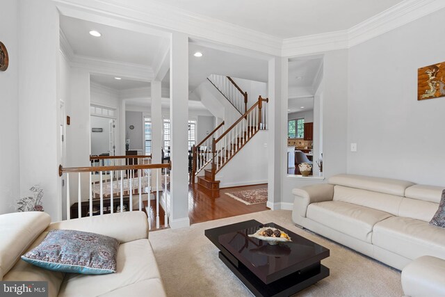 42735 Macauley Pl, Ashburn, VA 20148 - living area with ornamental molding, recessed lighting, stairway, wood finished floors, and baseboards