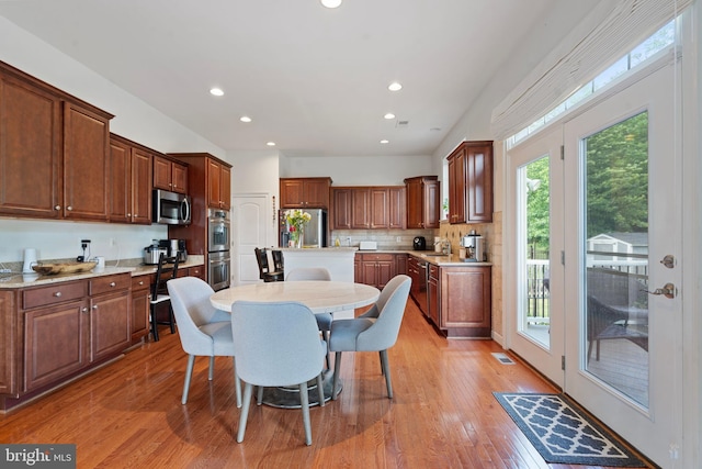 42735 Macauley Pl, Ashburn, VA 20148 - dining room with light wood finished floors and recessed lighting
