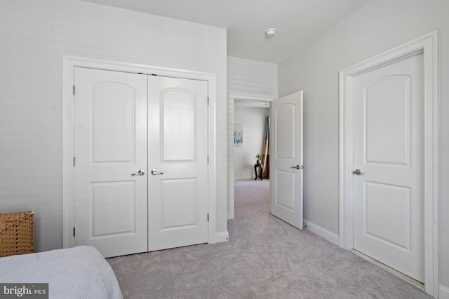 42735 Macauley Pl, Ashburn, VA 20148 - bedroom with light colored carpet, a closet, and baseboards