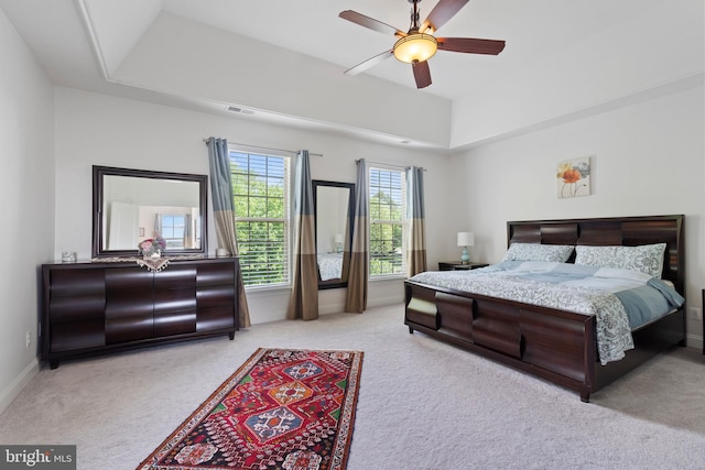 42735 Macauley Pl, Ashburn, VA 20148 - carpeted bedroom featuring baseboards, ceiling fan, and a tray ceiling