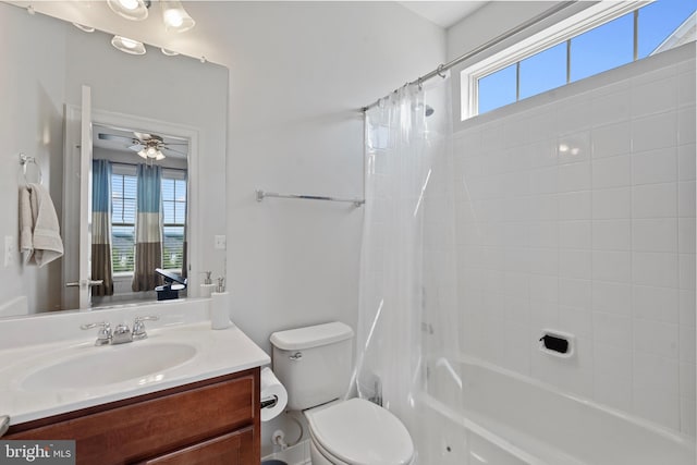 42735 Macauley Pl, Ashburn, VA 20148 - bathroom featuring vanity, shower / bath combo with shower curtain, toilet, and a ceiling fan