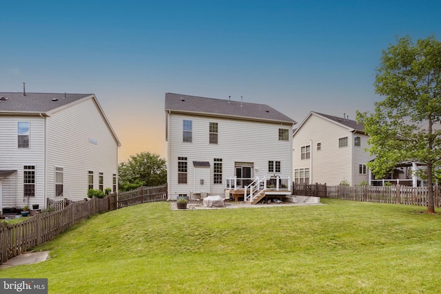 42735 Macauley Pl, Ashburn, VA 20148 - back of property at dusk with a wooden deck