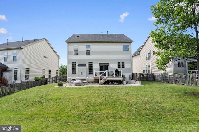42735 Macauley Pl, Ashburn, VA 20148 - back of property with an outdoor fire pit, a patio area, and a wooden deck