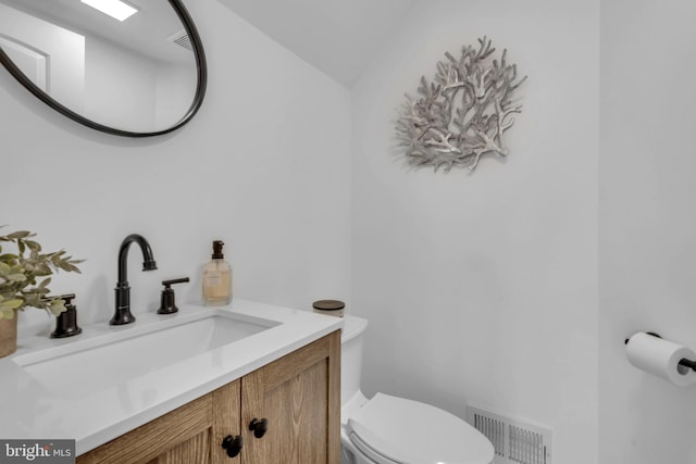 1328 Cox Cv, Stoney Beach, MD 21226 - half bath featuring vanity, toilet, and vaulted ceiling
