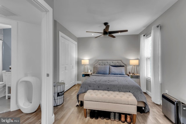 1328 Cox Cv, Stoney Beach, MD 21226 - bedroom with light wood-style floors, ceiling fan, and baseboards