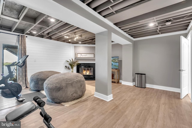 1328 Cox Cv, Stoney Beach, MD 21226 - exercise room with wood finished floors, baseboards, and a glass covered fireplace