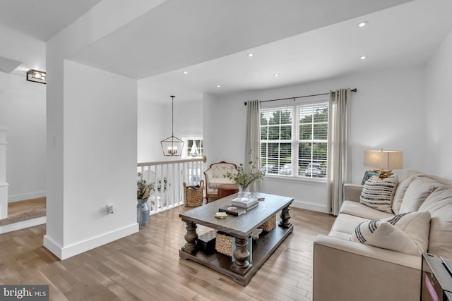 1328 Cox Cv, Stoney Beach, MD 21226 - living area featuring a chandelier, light wood-style floors, baseboards, and recessed lighting