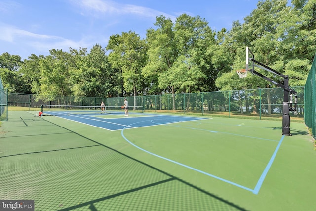 1328 Cox Cv, Stoney Beach, MD 21226 - view of tennis court featuring view of wooded area