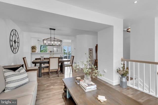 1328 Cox Cv, Stoney Beach, MD 21226 - living area featuring light wood-style flooring, a chandelier, baseboards, and recessed lighting