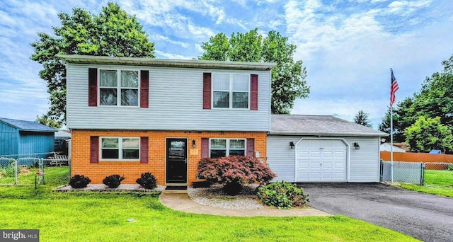 12 Rogers Cir, Newark, DE 19702 - colonial-style house featuring an attached garage and asphalt driveway