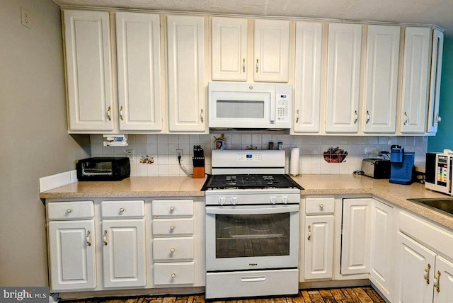 12 Rogers Cir, Newark, DE 19702 - kitchen featuring white appliances, tasteful backsplash, and white cabinets