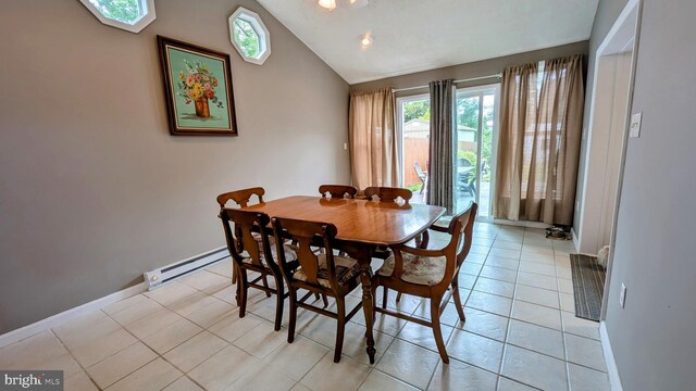12 Rogers Cir, Newark, DE 19702 - dining space with a baseboard radiator, baseboards, vaulted ceiling, and light tile patterned flooring