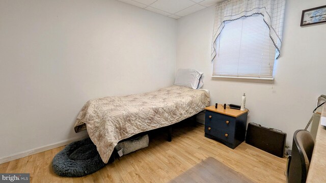 12 Rogers Cir, Newark, DE 19702 - bedroom with a paneled ceiling, light wood finished floors, and baseboards