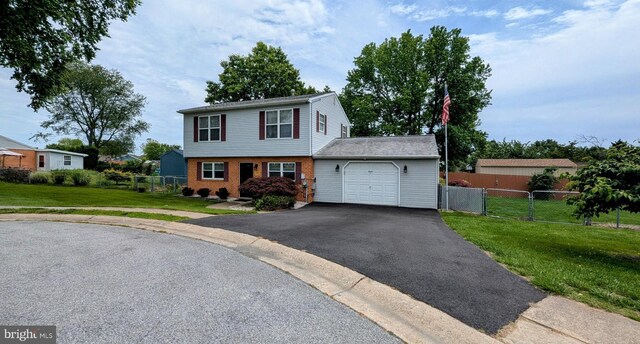 12 Rogers Cir, Newark, DE 19702 - colonial inspired home featuring an attached garage, driveway, and brick siding
