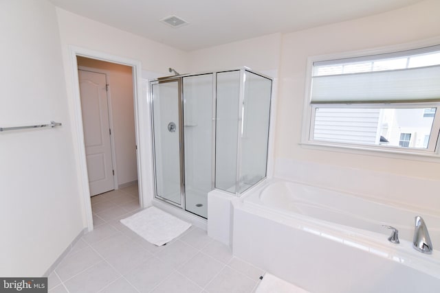 42344 Abney Wood Dr, Chantilly, VA 20152 - bathroom featuring a shower stall, a garden tub, and tile patterned flooring