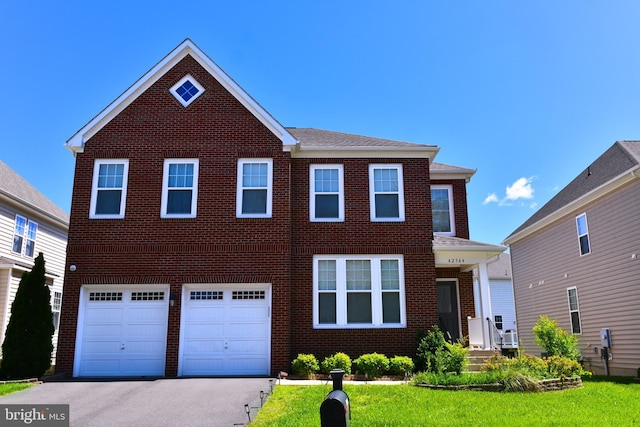 42344 Abney Wood Dr, Chantilly, VA 20152 - view of front of house featuring brick siding, a garage, asphalt driveway, and a front lawn