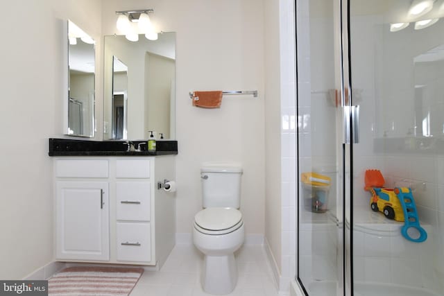 42344 Abney Wood Dr, Chantilly, VA 20152 - full bathroom featuring toilet, a shower stall, vanity, baseboards, and tile patterned flooring
