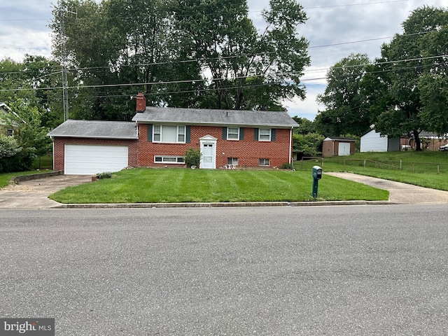 9505 Queensway Rd, Upper Marlboro, MD 20772 - split foyer home with a garage, a chimney, concrete driveway, and brick siding