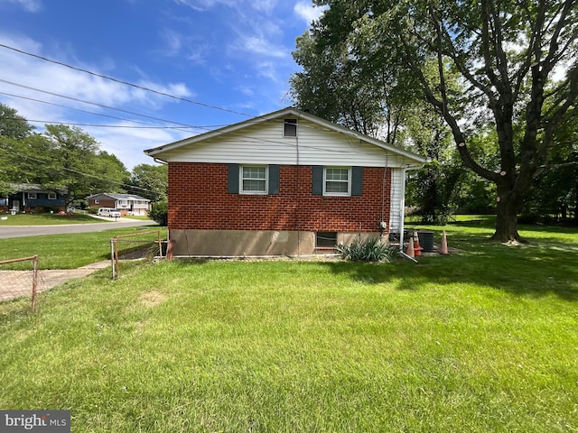 9505 Queensway Rd, Upper Marlboro, MD 20772 - view of side of property with brick siding and a yard