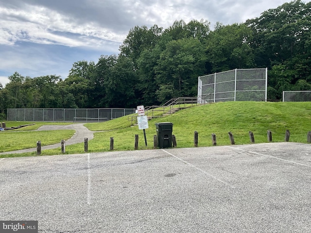 9505 Queensway Rd, Upper Marlboro, MD 20772 - view of community featuring uncovered parking and a view of trees