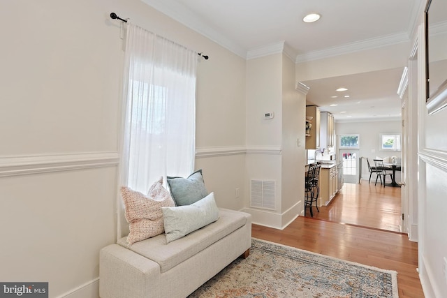 1201 Cooksie St, Baltimore, MD 21230 - sitting room featuring light wood-style floors, crown molding, and recessed lighting