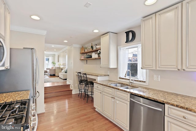 1201 Cooksie St, Baltimore, MD 21230 - kitchen with stainless steel dishwasher, ornamental molding, light wood-type flooring, light stone countertops, and recessed lighting