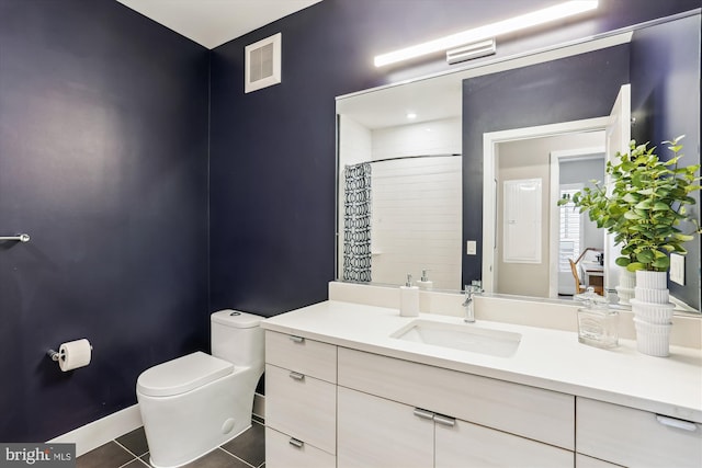 510 Diamondback Dr Unit 469, Gaithersburg, MD 20878 - full bathroom featuring vanity, toilet, a shower with shower curtain, tile patterned flooring, and baseboards