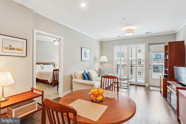 510 Diamondback Dr Unit 469, Gaithersburg, MD 20878 - dining area featuring crown molding, wood finished floors, ceiling fan, and baseboards