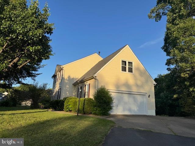 11 Basalt Dr, Fredericksburg, VA 22406 - view of side of property featuring a garage, asphalt driveway, and a yard