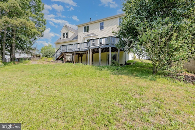 11 Basalt Dr, Fredericksburg, VA 22406 - back of property with a wooden deck, a lawn, and stairway